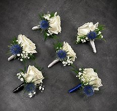 White Spray Rose & Blue Thistle Boutonnière Collection